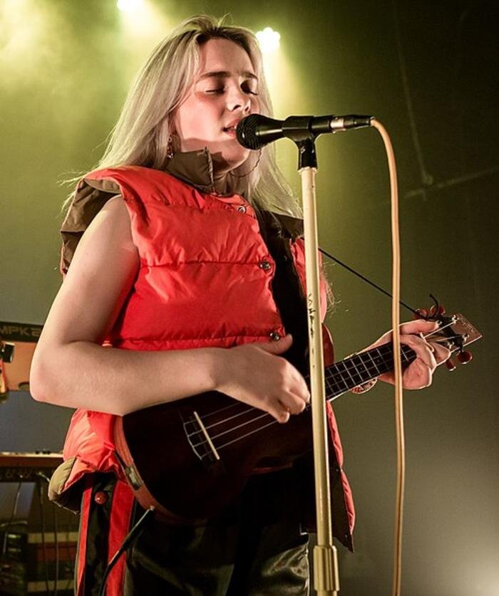 Billie Eilish performing with a ukulele