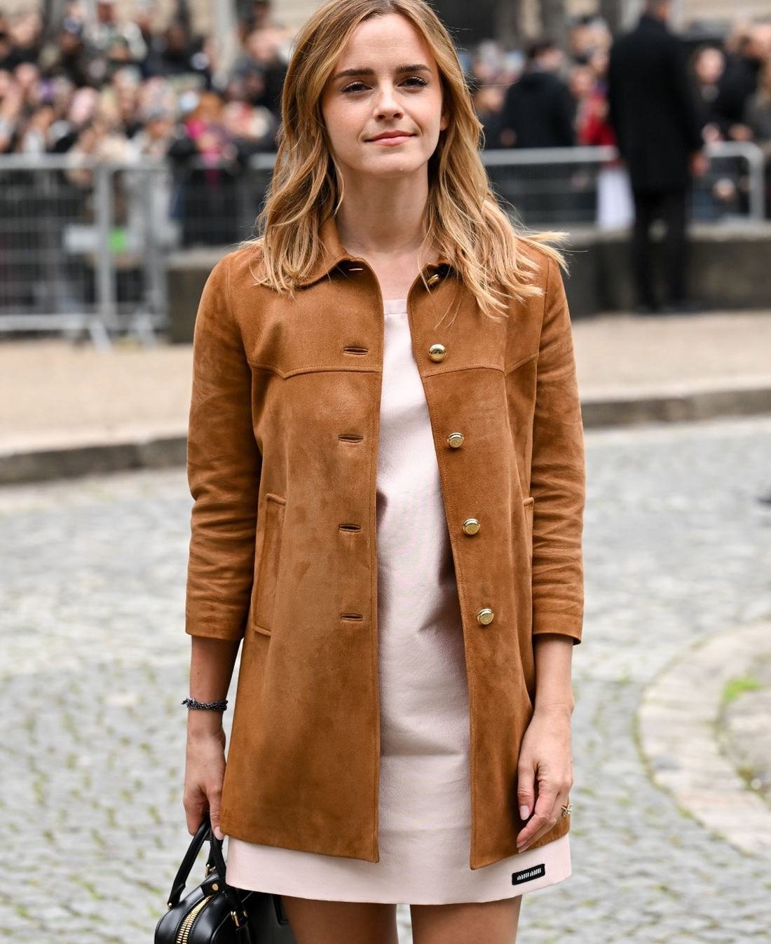Emma Watson in a tan suede coat