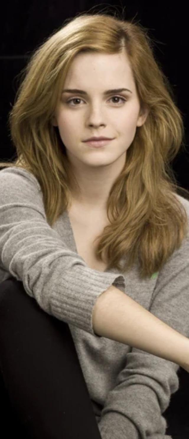 Emma Watson in a grey knit sweater