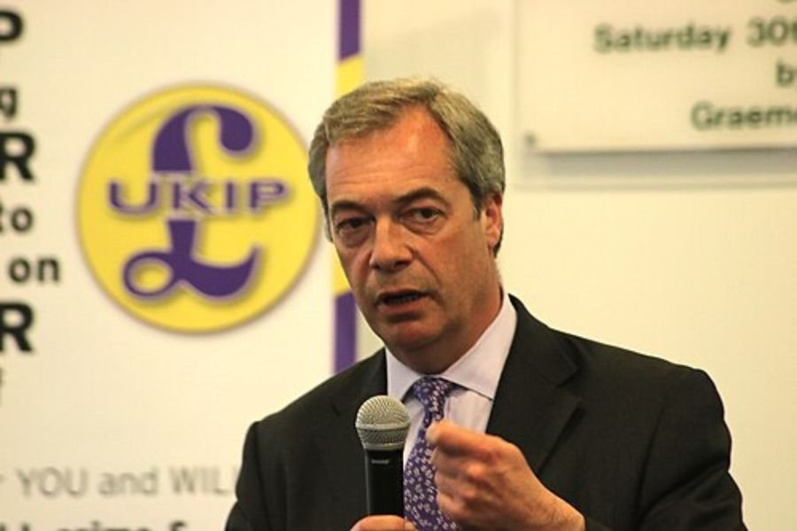 Man holding a microphone while speaking, used in the media section of the Nigel Farage biography