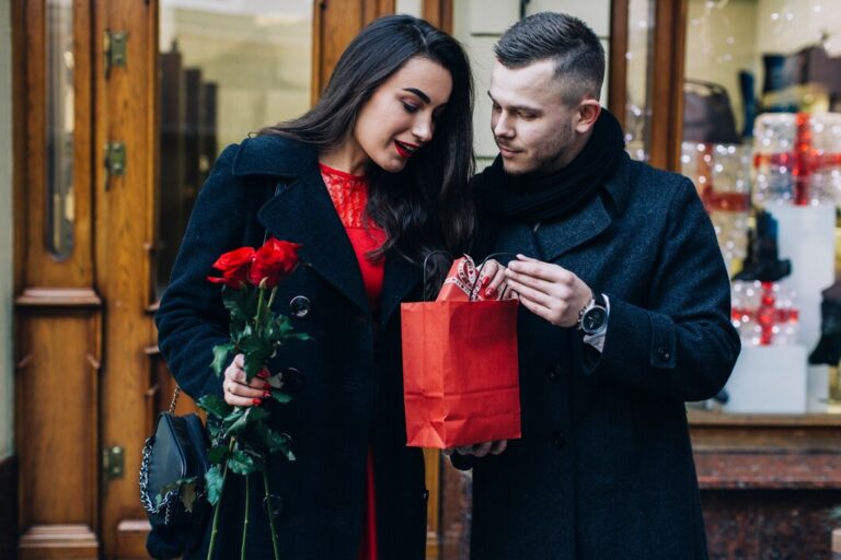 man-presenting-gift-pretty-lady_23-2147735675