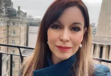 Elizabeth Rizzini presenting the weather on BBC News, showcasing her professional confidence and warm presence.