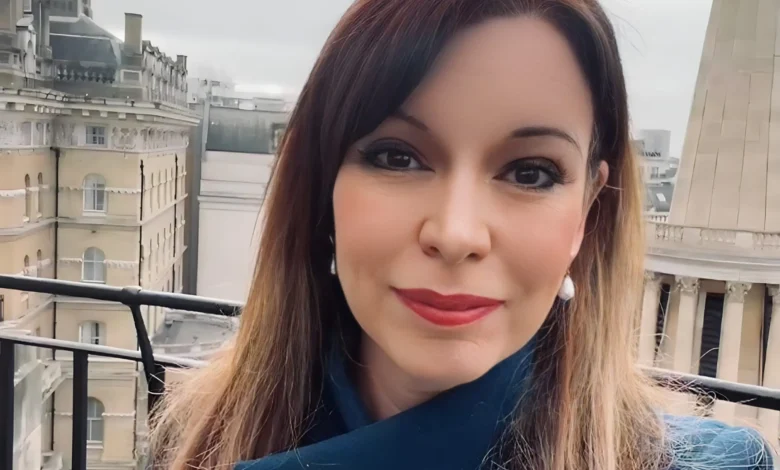 Elizabeth Rizzini presenting the weather on BBC News, showcasing her professional confidence and warm presence.