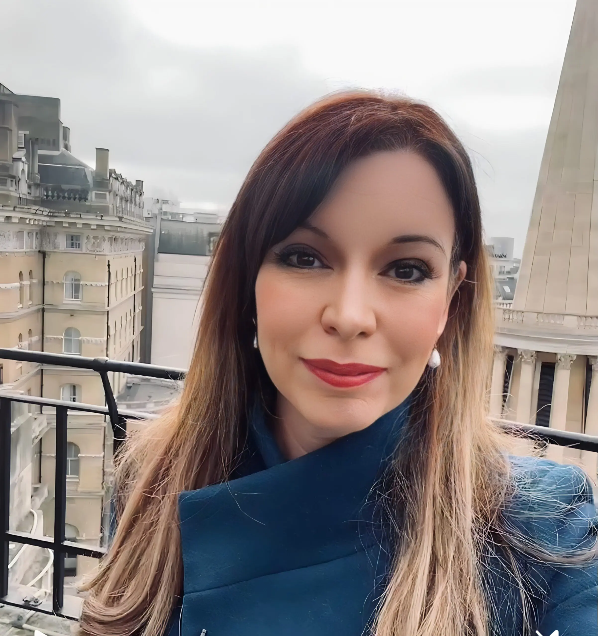 Elizabeth Rizzini presenting the weather on BBC News, showcasing her professional confidence and warm presence.